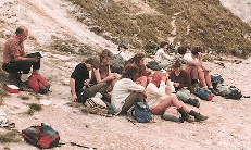 Picture of people sitting on a beach.