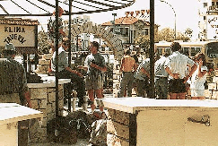 Another picture of people hanging around
outside an appartment block in Cyprus