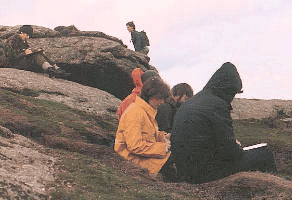 Picture of people sitting on granite outcrops