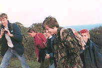 Picture of Rob Bird, Myra Keep, Cally and
Lorraine Stanley walking up the hill from Hopes Nose point with David
Harrison about to take a photograph.